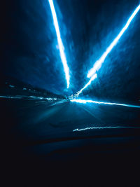 Aerial view of illuminated car on road at night