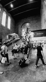 Man standing on railroad station platform