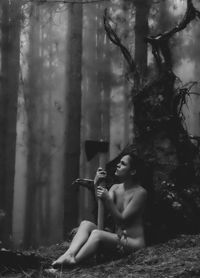 Woman sitting in a forest