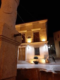 Low angle view of illuminated building at night