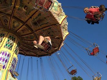 Low angle view of ferris wheel against sky