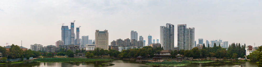 Panoramic view of city and buildings against sky