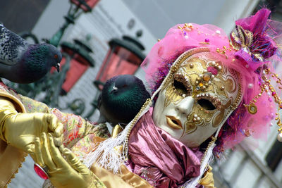 Close up of person in costume and mask during event