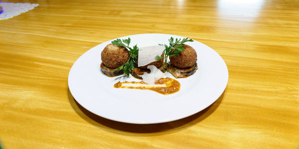 Food served in plate on wooden table