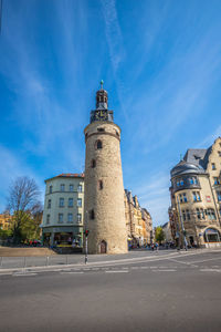 Low angle view of buildings against blue sky