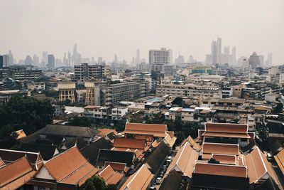 High angle view of buildings in city against sky