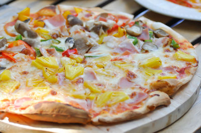 Close-up of pizza served on table