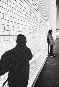 Rear view of two people walking outdoors