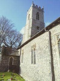 Low angle view of bell tower against sky