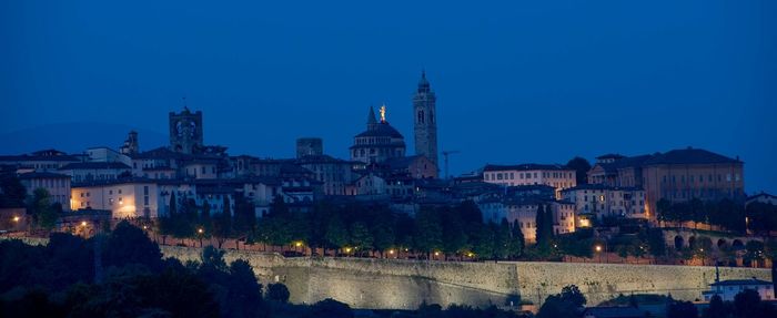 Illuminated buildings in city at night