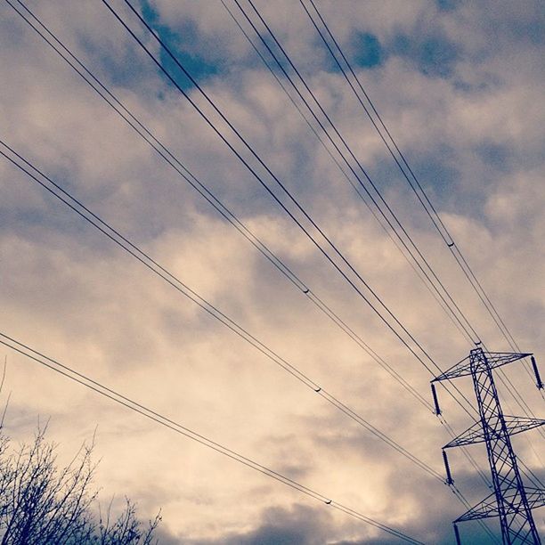 power line, electricity pylon, low angle view, sky, power supply, electricity, cable, connection, cloud - sky, cloudy, fuel and power generation, silhouette, technology, cloud, power cable, complexity, outdoors, no people, nature, dusk