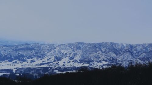 Scenic view of snow covered mountains