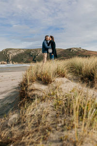 Couple kissing at beach