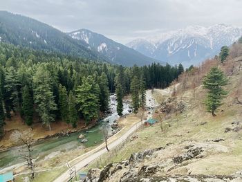 High angle view of trees and mountains against sky