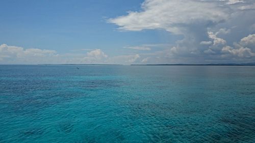 Scenic view of sea against blue sky