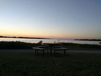 Scenic view of sea against clear sky during sunset