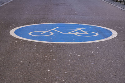 High angle view of road sign on street