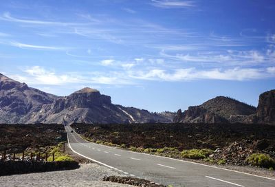 Road leading towards mountains