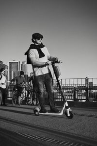 Man standing on street against clear sky