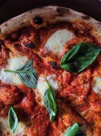 Close-up of mint leaves on pizza