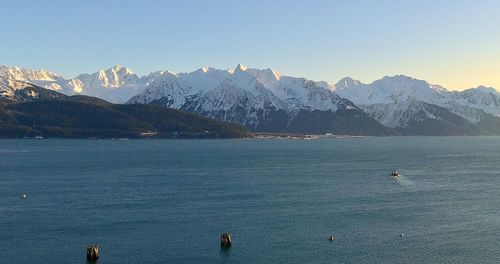 Scenic view of snowcapped mountains against sky