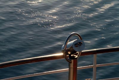 Close-up of sailboat sailing in sea