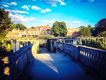 Bridge over river with buildings in background