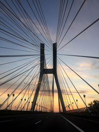 Low angle view of bridge against sky during sunset