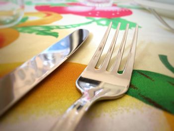 Close-up of knife and fork on table