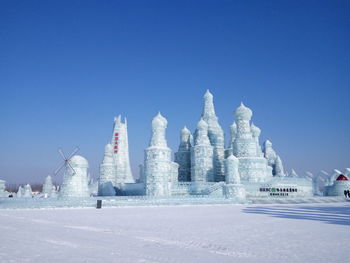 Traditional building against blue sky during winter