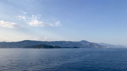 Scenic view of sea against blue sky