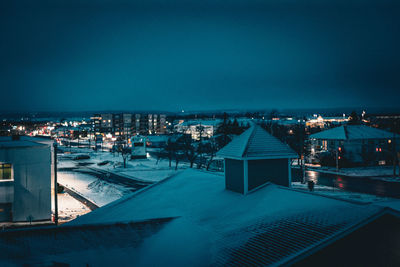 Illuminated buildings in city at night