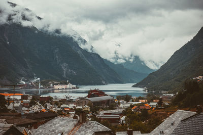 Panoramic view of lake and buildings against sky