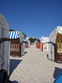 View of beach against clear blue sky