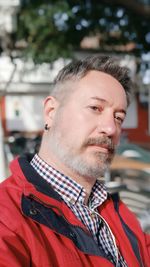 Portrait of mature man looking away outdoors