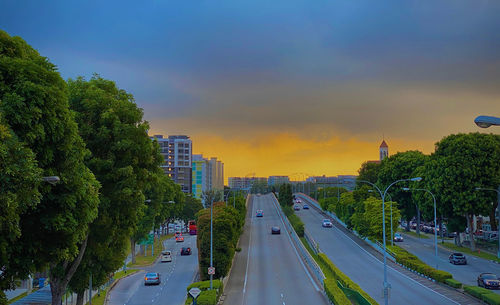 High angle view of city street against sky during sunset