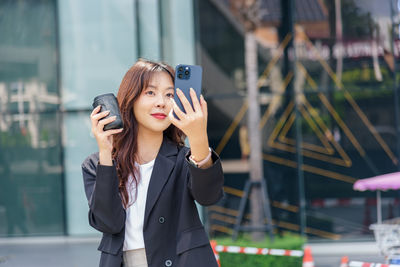 Young woman using mobile phone