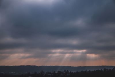 Scenic view of landscape against cloudy sky