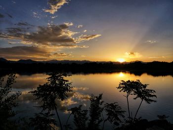 Scenic view of lake against sky during sunset