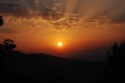 Scenic view of silhouette landscape against sky during sunset