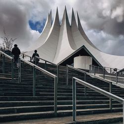 Built structure against cloudy sky
