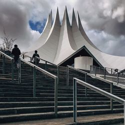 Low angle view of men walking on steps at tempodrom berlin