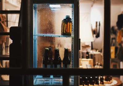 Close-up of beer bottles on table at restaurant