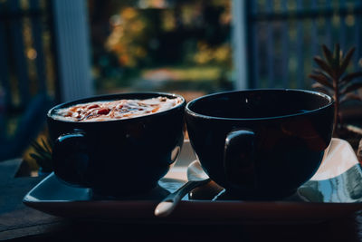 Close-up of coffee cup on table