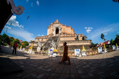 Low angle view of church against cloudy sky