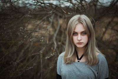 Portrait of a beautiful young woman in forest