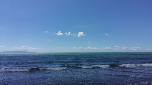 Scenic view of sea against blue sky