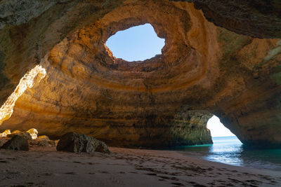 Scenic view of sea seen through cave