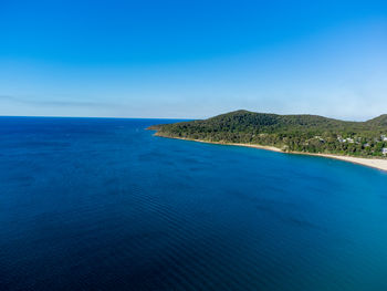 Scenic view of sea at noosa heads against clear blue sky