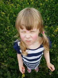 Girl standing on grassy field